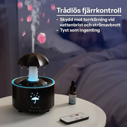 Svart aromadiffuser med LED-belysning, fjärrkontroll och dimma på nattduksbord med säng i bakgrunden